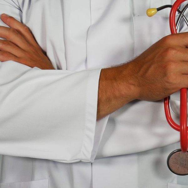 A doctor holding a stethoscope in his hand