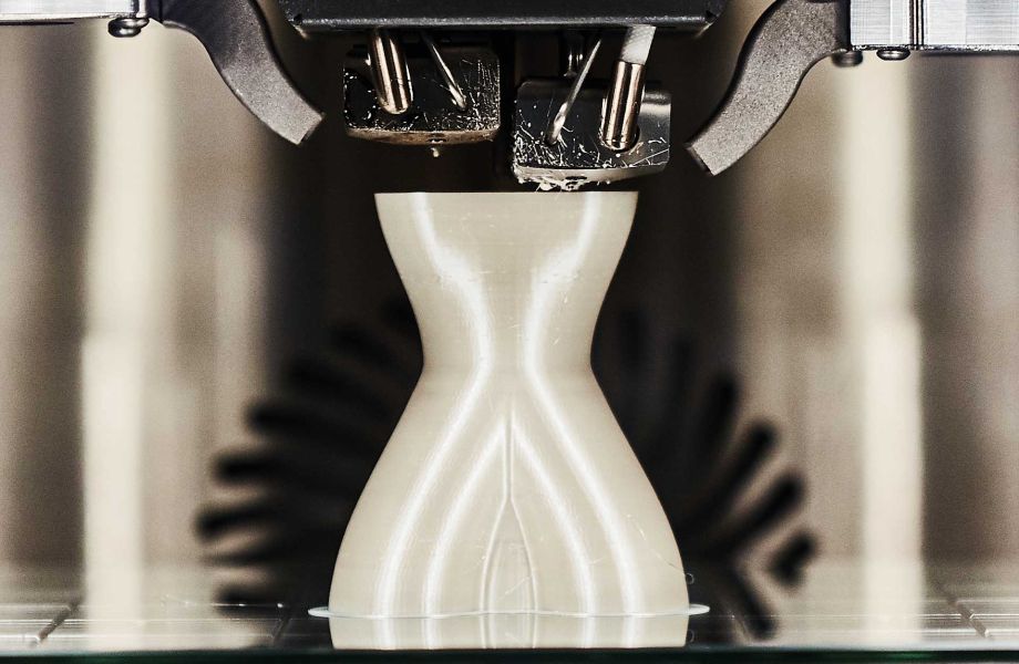 A white part is additively manufactured
