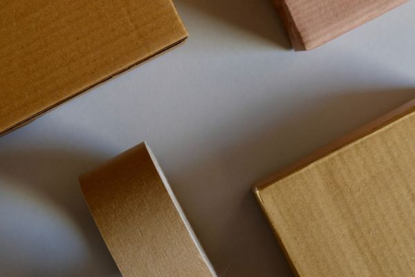 Three parcels and a parcel tape