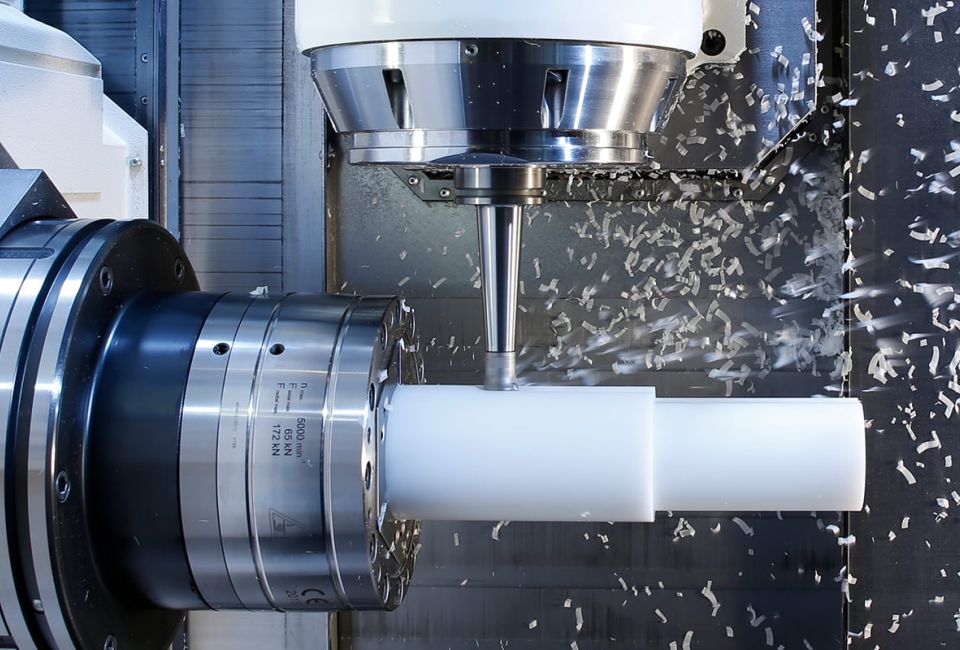 A plastic part that is currently being machined by milling