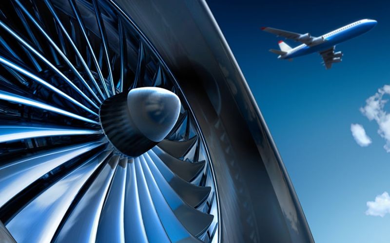 A jet engine over which an aircraft flies in the sky