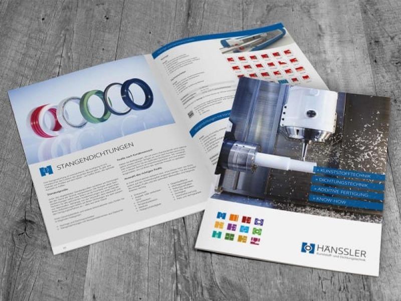Two issues of the sealing technology brochure, one of them is open